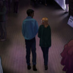 Kiera and Ed walking the school hall.
